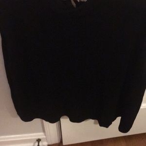 Black sleeveless top.